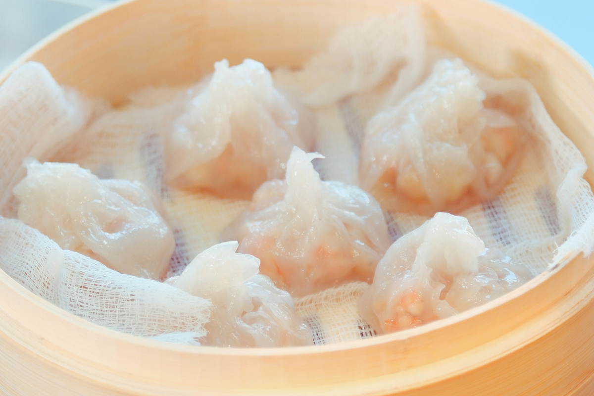 A plate of steamed Rice Paper Shrimp Dumplings, filled with Fishta White Shrimp, garlic, and soy sauce.